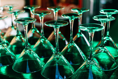 Close-up of wine glasses on table