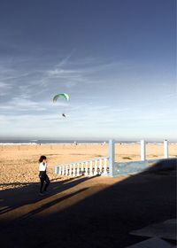 Man on beach against sky
