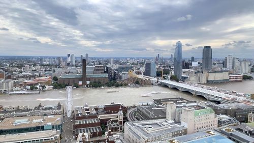 High angle view of buildings in city against sky