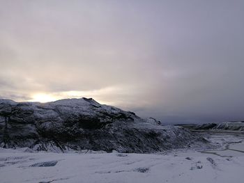 Scenic view of mountains against sky during winter