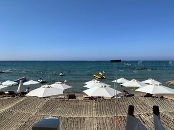 Scenic view of sea against clear blue sky