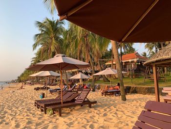 Lounge chairs and parasols on beach