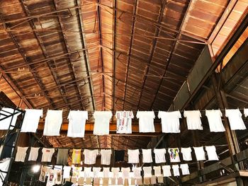 Stack of clothes hanging on wood