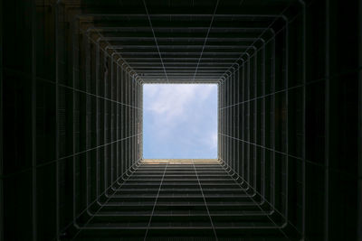 Directly below shot of buildings against sky