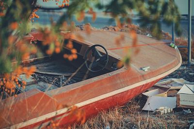 Abandoned boat on field