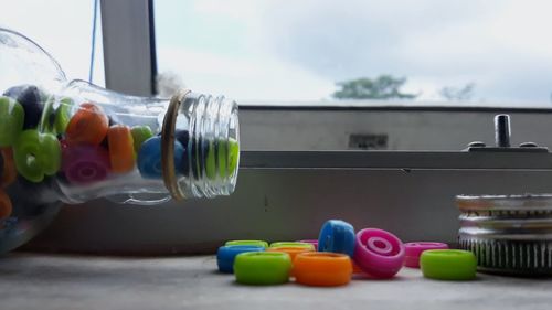 Close-up of multi colored candies in glass on table