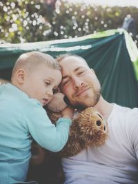 Portrait of father embracing son