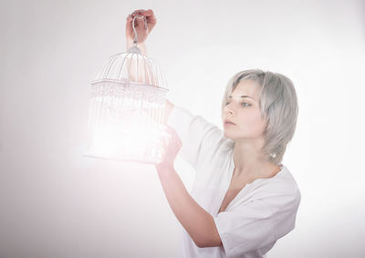 Portrait of a beautiful young woman over white background