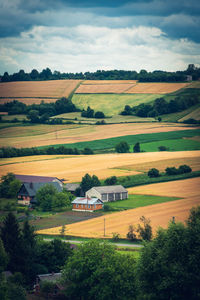 The farm is situated among hills with arable fields. beautiful agricultural landscape. 