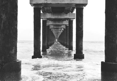 Pier over sea against sky