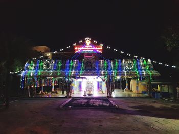 Illuminated buildings in city at night