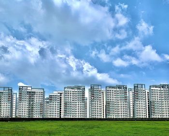 Modern buildings against sky in city