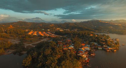 High angle view of trees and buildings against sky