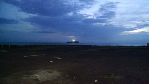 Scenic view of sea against sky at night