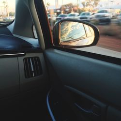 Reflection of car on side-view mirror