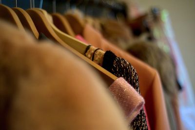 Close-up of clothes hanging at store for sale