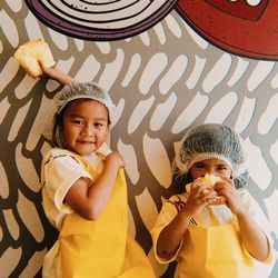 Portrait of a smiling girl holding camera