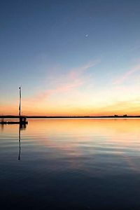 Scenic view of sea at sunset