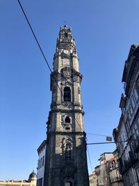 Low angle view of building against clear blue sky, torre dos clérigos, porto