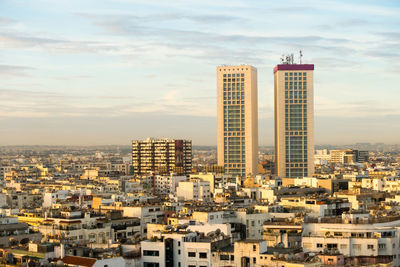 Modern buildings in city against sky