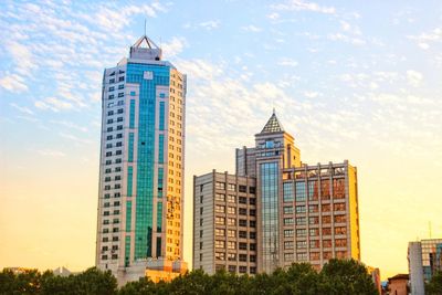 Low angle view of buildings in city against sky