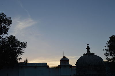 Silhouette of building at sunset