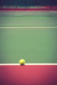 Close-up of yellow ball on table