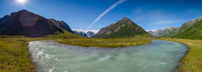 Scenic view of landscape against blue sky