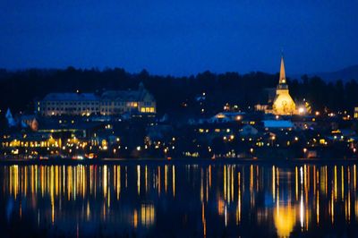 Reflection of illuminated buildings in water