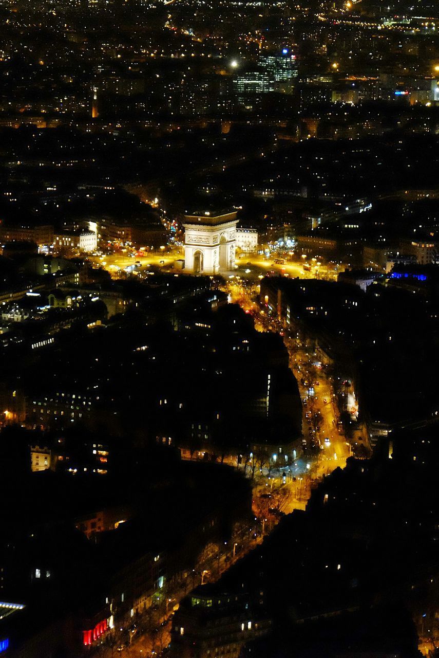 AERIAL VIEW OF ILLUMINATED CITYSCAPE AT NIGHT