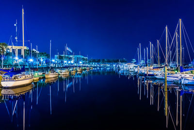 Boats moored at harbor