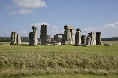 Built structure on field against sky