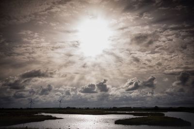 View of calm sea against cloudy sky