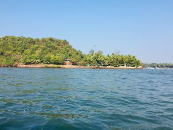 Scenic view of sea against clear blue sky