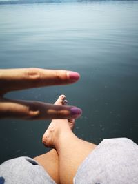 Low section of woman legs in lake