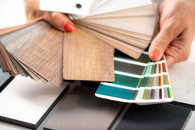 Interior designer matching color samples. choosing compact boards and color palette material samples