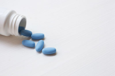 Close-up of bottle with pills on table