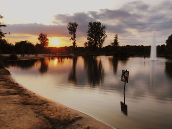 Scenic view of lake against sky during sunset