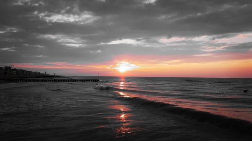 Scenic view of sea against dramatic sky