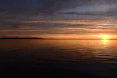 Scenic view of sea against orange sky