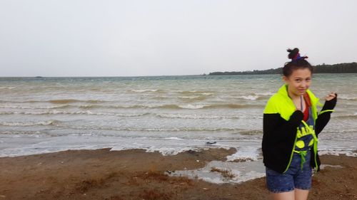 Woman standing on beach