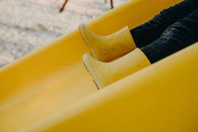 Low section of child on slide at playground