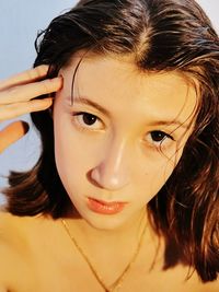 Close-up portrait of smiling young woman