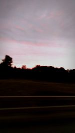 Scenic view of silhouette landscape against sky at sunset