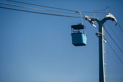 Low angle view of street light against clear blue sky