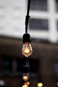 Close-up of illuminated light bulb