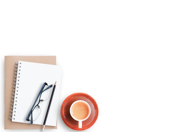 Directly above shot of coffee cup against white background