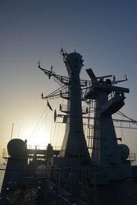 Low angle view of crane against sky