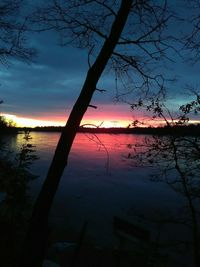 Scenic view of lake against romantic sky at sunset