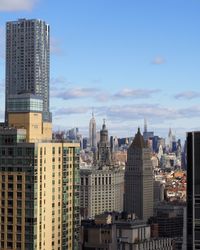 View of skyscrapers against blue sky